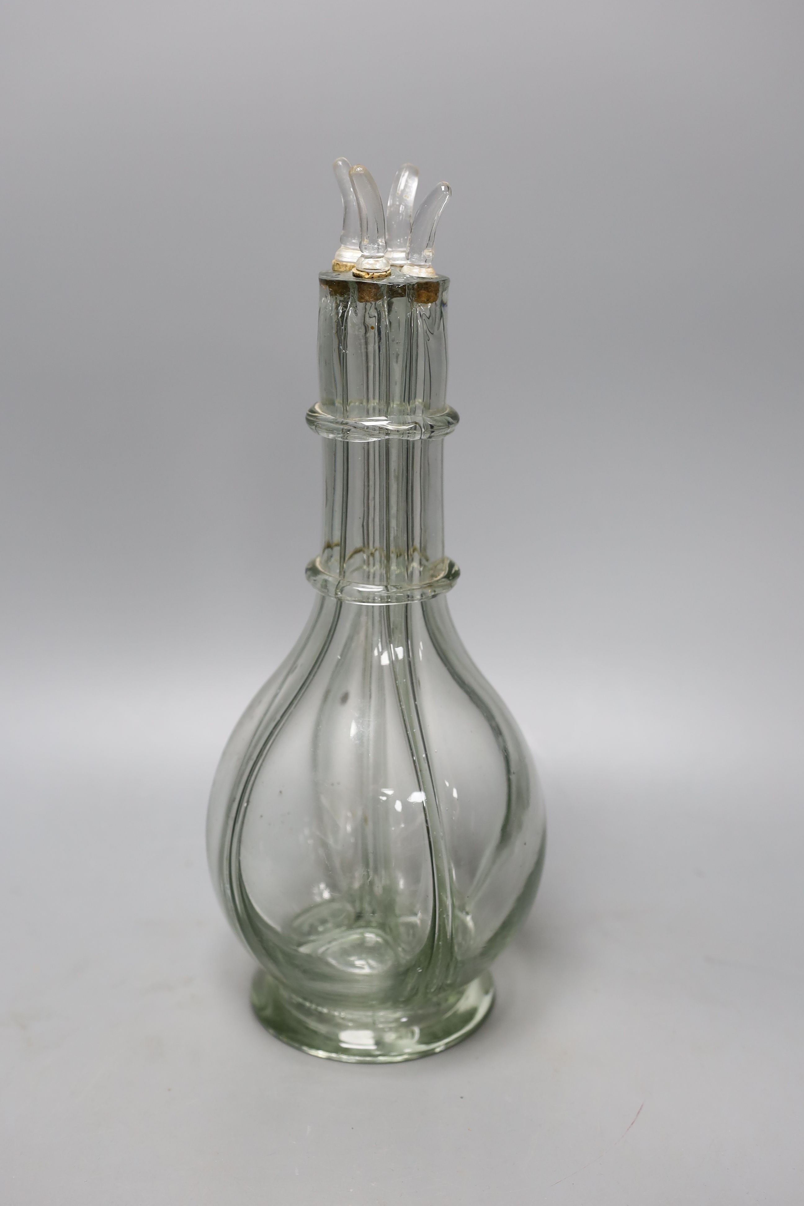 A French four division moulded glass oil and vinegar bottle, 32cm